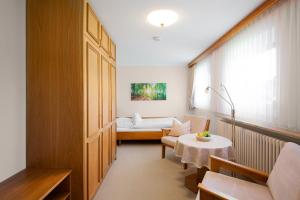 Postel nebo postele na pokoji v ubytování Gästehaus Prinzregent Luitpold
