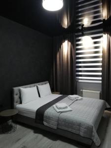 Postel nebo postele na pokoji v ubytování Prometey Hotel