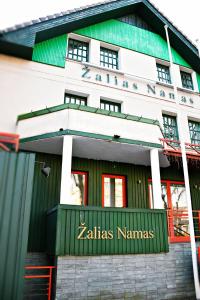 a building with a sign that reads zahlas naminas at Žalias namas in Palanga