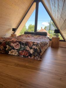 Säng eller sängar i ett rum på Woodparadise