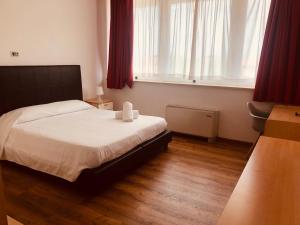 A bed or beds in a room at Residence Panigale