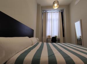 Posteľ alebo postele v izbe v ubytovaní New Samay Hostel