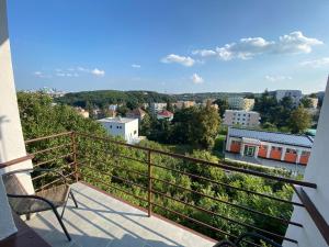 a balcony with a view of a city at Apartman Xaveriova in Prague