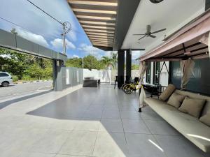 a living room of a house with a couch at Spacious Home with Private Swimming Pool in Langkawi by Zervin in Kuah