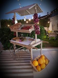 a food stand with fruits and vegetables on a table at TERRA MIA in Città Giardino +68 photos