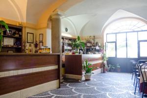 a restaurant with a counter and a bar in a room at Villa Altieri in Albano Laziale +44 photos