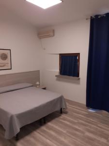 Voodi või voodid majutusasutuse Hotel Capo Di Stella toas