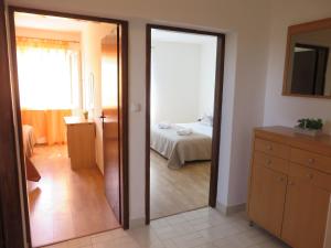 Postel nebo postele na pokoji v ubytování Holiday home Marija i Lucija