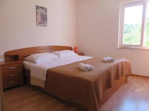 Postel nebo postele na pokoji v ubytování Holiday home Marija i Lucija