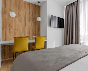 En eller flere senge i et værelse på Boutique Hotel Французький Квартал