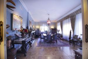 a living room with a table and a dining room at Hotel Xabier in Javier