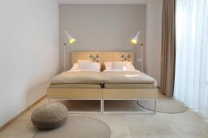 Postel nebo postele na pokoji v ubytování Apartmány OMEGA
