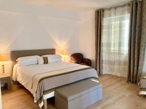 Postel nebo postele na pokoji v ubytování Hotel la Caravelle