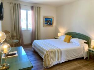 Postel nebo postele na pokoji v ubytování Hotel la Caravelle
