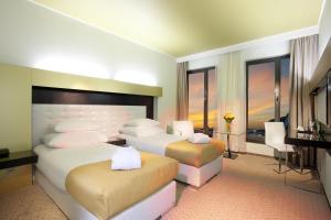 Postel nebo postele na pokoji v ubytování Grandior Hotel Prague