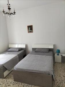 Postel nebo postele na pokoji v ubytování NOEMI & JULIENNE