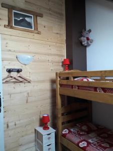 Postel nebo postele na pokoji v ubytování Chalet Lucie LE CHEVAL NOIR