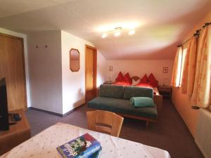 A bed or beds in a room at Pension Tannheim