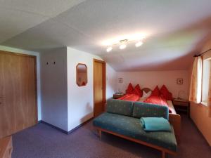 A bed or beds in a room at Pension Tannheim