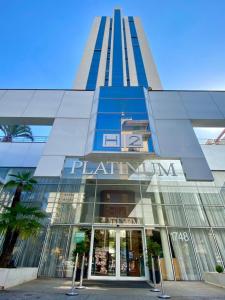 a tall building with a store in front of it at H2 Platinum Lourdes in Belo Horizonte