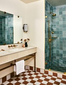 a bathroom with a sink and a shower at Alsace LA in Los Angeles