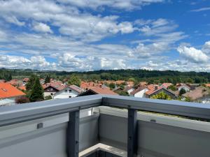 a balcony with a view of a city at Ferienwohnung im Herzen Allgäu in Altusried