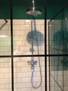 a shower in a bathroom with a glass door at Lyndhurst - Victorian villa with heated pool in Roby +41 photos