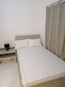 Una cama o camas en una habitación de Jz Plus Classio