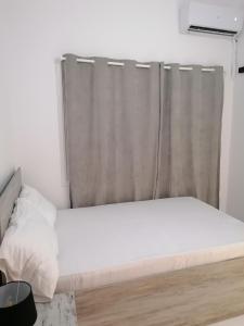 Una cama o camas en una habitación de Jz Plus Classio
