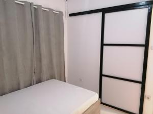 Una cama o camas en una habitación de Jz Plus Classio