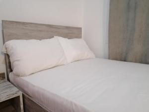Una cama o camas en una habitación de Jz Plus Classio