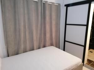 Una cama o camas en una habitación de Jz Plus Classio