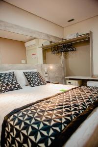 Tempat tidur dalam kamar di Bristol Viçosa Hotel