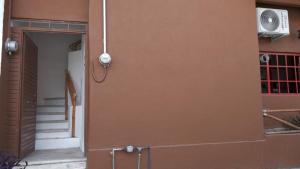 an open door to a building with a stairway at Depa Versalles Puerto Vallarta in Puerto Vallarta