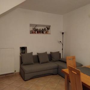 a living room with a couch and a picture on the wall at Casa Marta in Cividale del Friuli