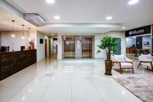 a lobby of a hospital with chairs and a waiting room at Transamerica Fit Contagem in Contagem +47 photos