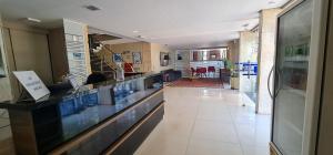 a hallway with a long counter in a building at Hotel El Pilar in Brasília