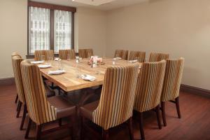 a conference room with a long wooden table and chairs at The Bolling Wilson Hotel in Wytheville
