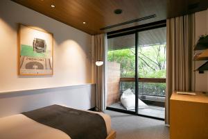 Llit o llits en una habitació de TRUNK (HOTEL)