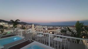 a balcony with a view of a city at La Puerta de Nerja BOUTIQUE - Adults Recommended in Nerja