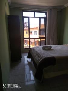 Ένα ή περισσότερα κρεβάτια σε δωμάτιο στο Paradise Hostel e Flats +37 φωτογραφίες