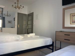 Tempat tidur dalam kamar di Porto Chania