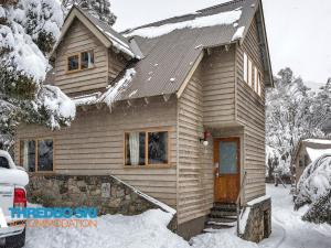 a small house with snow on the porch at Granite Peaks 1 in Thredbo