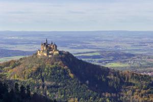 an castle on the top of a hill at Gästehaus Burgblick in Bisingen +11 photos