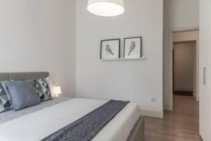 Posteľ alebo postele v izbe v ubytovaní Palazzo Tergesteo Tirabora Suite Apartments