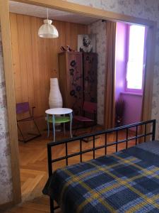 Postel nebo postele na pokoji v ubytování Chambres d'Hotes Le Passiflore