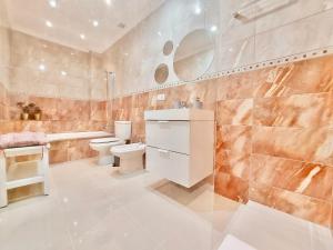 Kúpeľňa v ubytovaní Aromas Suites Apartments