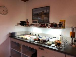 a kitchen with a buffet with food on a counter at Hotel Pension Norddeich in Norddeich
