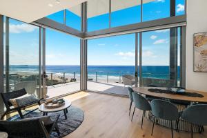 a living room with a view of the ocean at Rise Maroochydore in Maroochydore