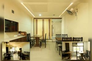 a kitchen and dining room with a table and chairs at Hotel New Apex in Ankleshwar